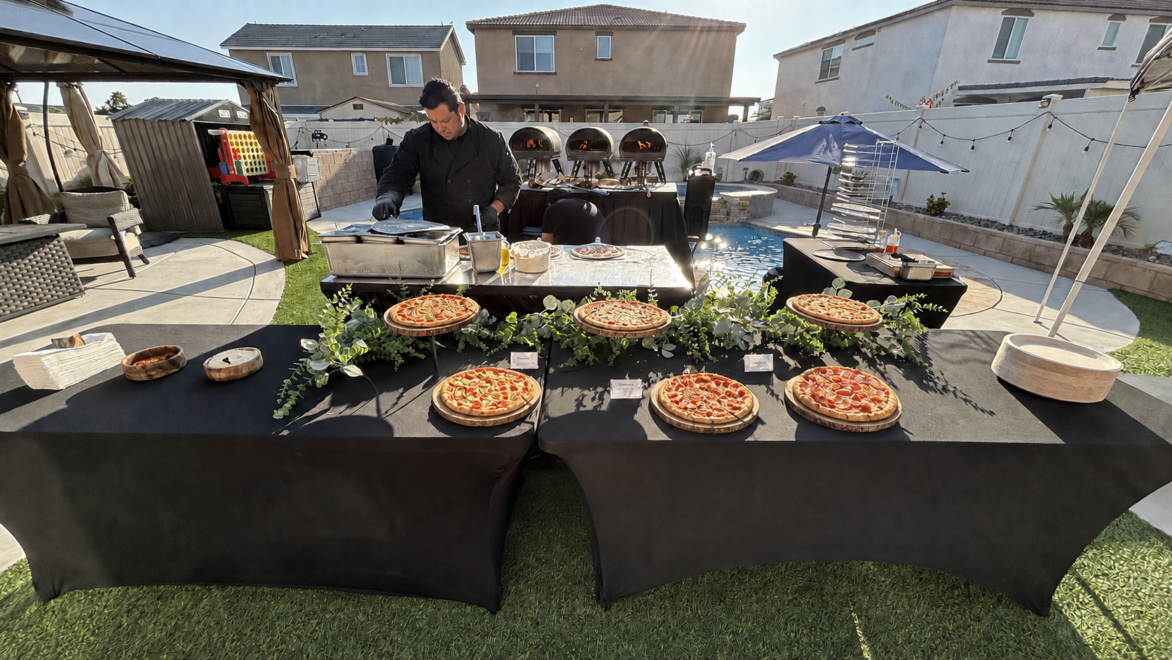 REDs Pizza buffet with pizzas displayed on wood stands